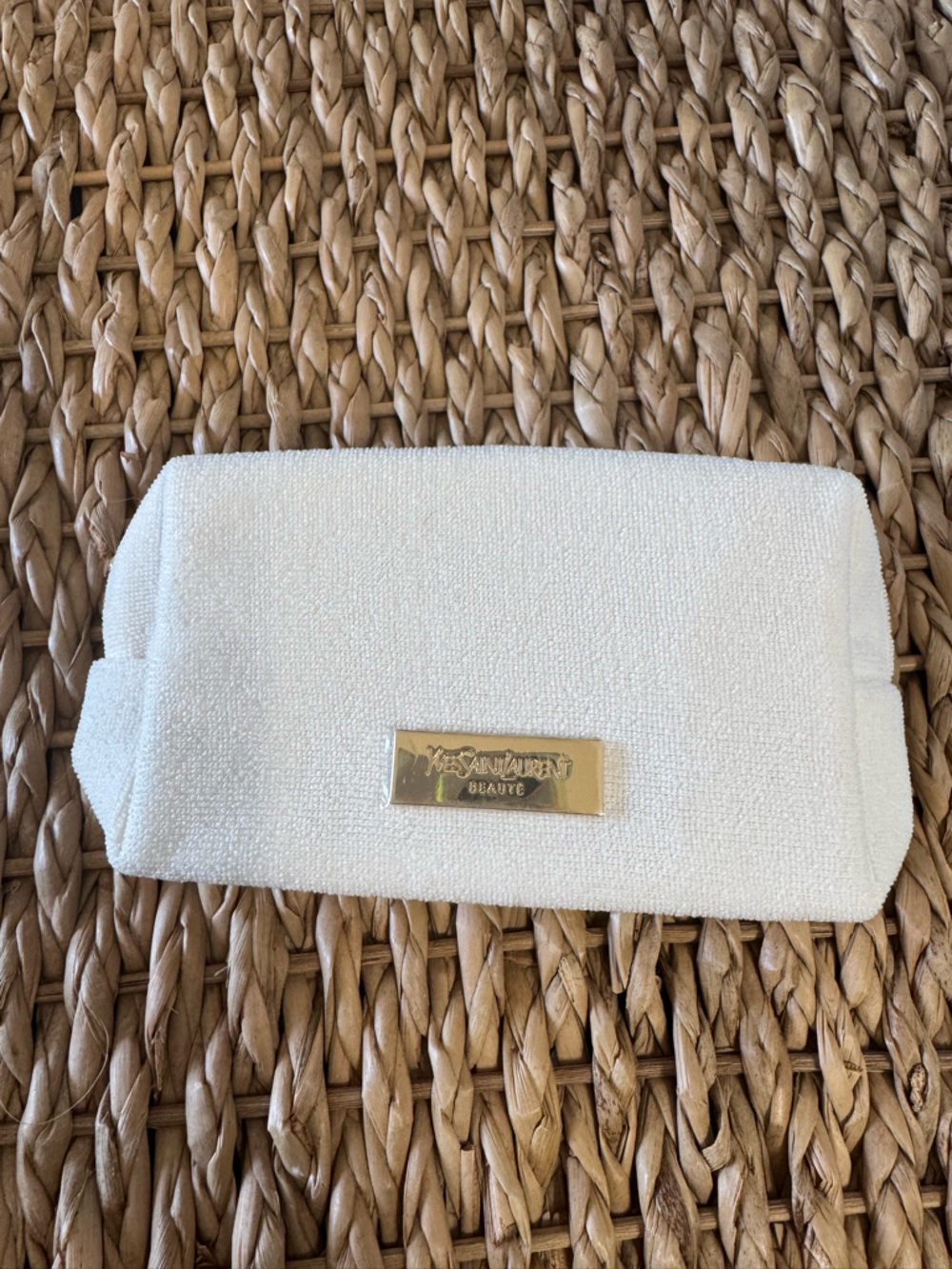 Yves Saint Laurent Gold Logo Plaque on Cream Textured Pouch